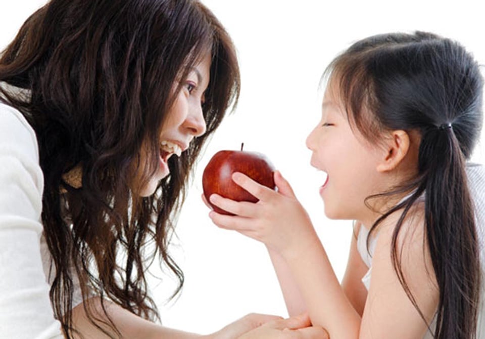 Red delicious apple, mother, daughter, eating