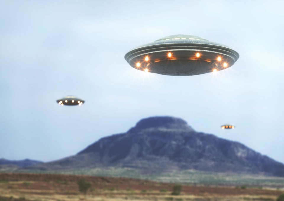 Three UFOs flying over the mountain