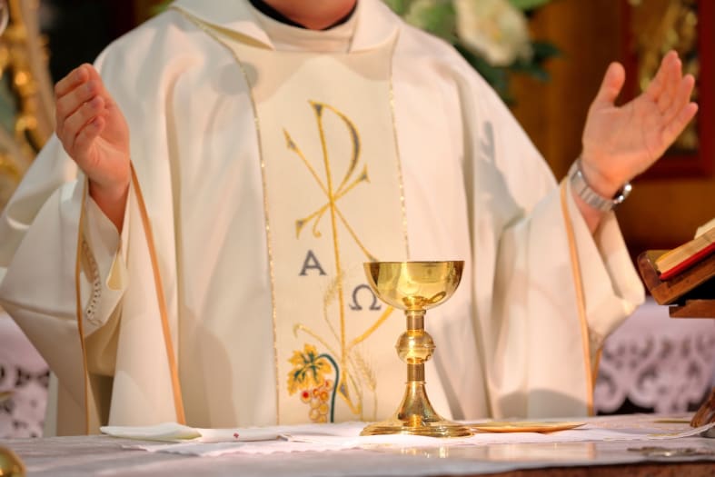 Is there no respect? Rapping priest gives mass wearing a baseball cap, chains and sunglasses