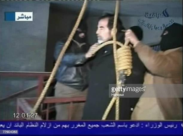 BAGHDAD, IRAQ - DECEMBER 30: In this television screen grab taken from Iraqi national television station Al-iraqia, a video shows the moments leading up to the execution of former Iraqi dictator Saddam Hussein standing on the gallows as he prepared for hanging, on December 30, 2006 in Baghdad, Iraq. The former Iraqi president was executed by hanging at 0600 (0300 GMT) in a secure facility in the Northern Baghdad suburb of Khadimeya. (Photo by Al-iraqia via Getty Images) BAGHDAD, IRAQ - DECEMBER 30: In this television screen grab taken from Iraqi national television station Al-iraqia, a video shows the moments leading up to the execution of former Iraqi dictator Saddam Hussein standing on the gallows as he prepared for hanging, on December 30, 2006 in Baghdad, Iraq. The former Iraqi president was executed by hanging at 0600 (0300 GMT) in a secure facility in the Northern Baghdad suburb of Khadimeya. (Photo by Al-iraqia via Getty Images)