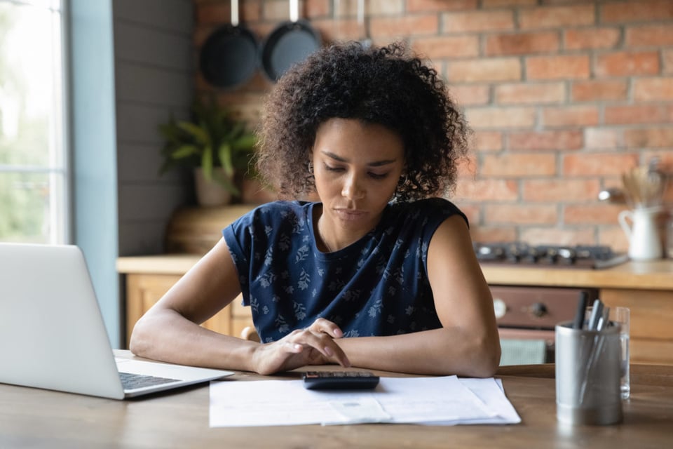 paying bills, late fees, counting, calculator, woman