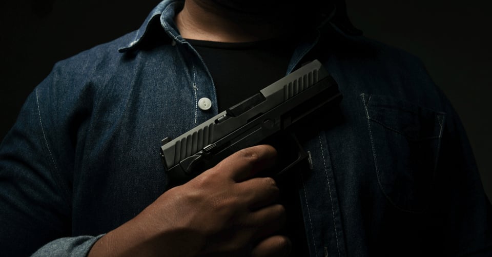 A killer with a gun in his hand