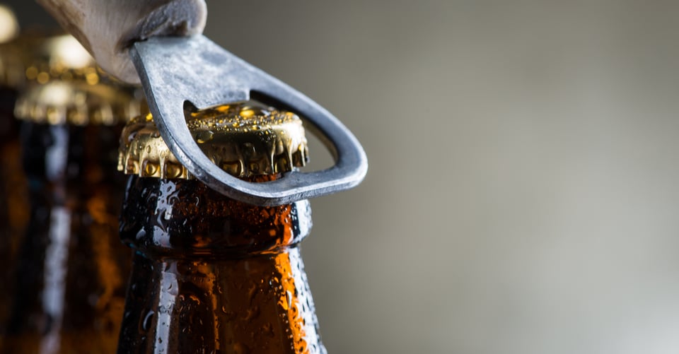 a beer cap being removed
